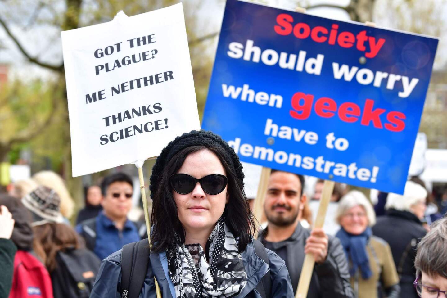 Dutch science fans carry signs in the March for Science in Amsterdam.