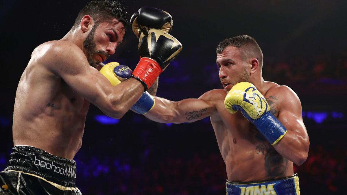 Vasiliy Lomachenko lands a punch against Jorge Linares during their WBA lightweight title fight at Madison Square Garden on Saturday.