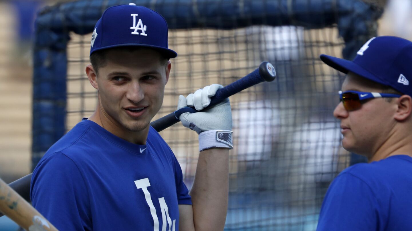 Young Dodgers stars Corey Seager, left, and Joc Pederson take batting practice before the start of Game 7.