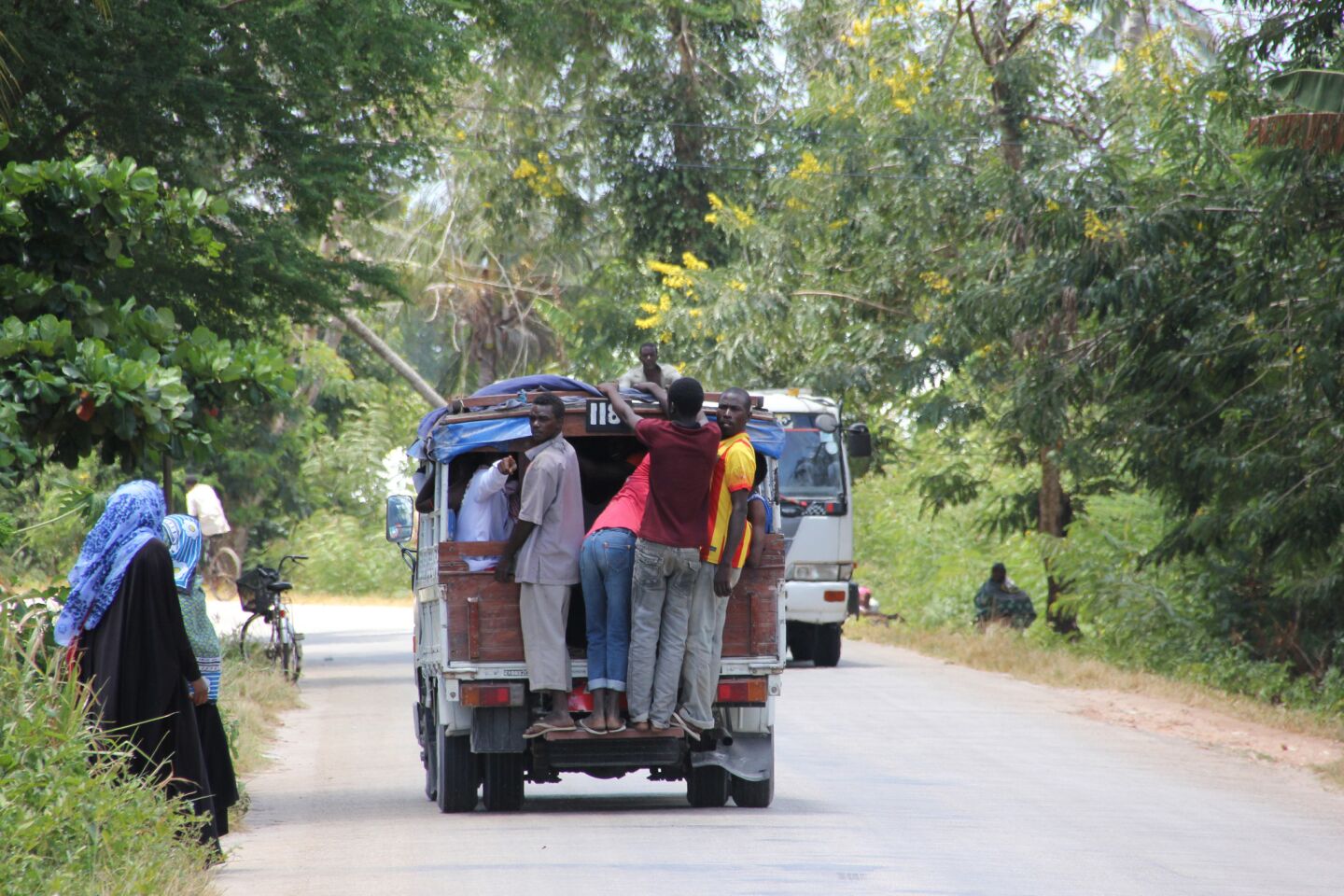 People stand on a Pick-up Truck, Zanzibar, Tanzania, Indian Ocean, East Africa