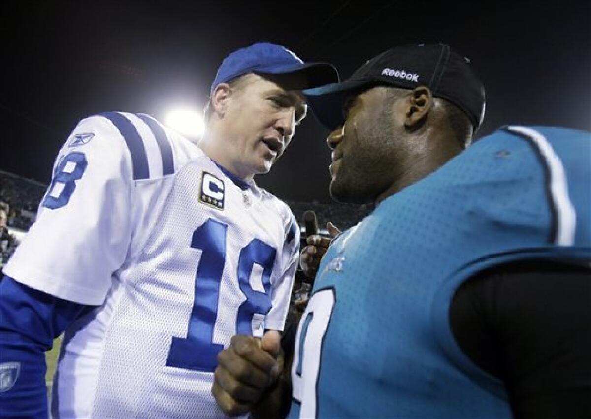 Jacksonville's quarterback David Garrard (#9) picks up a 13-yard