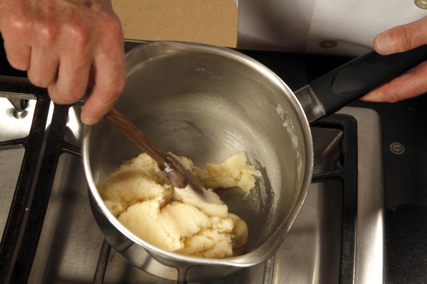 Beat in the flour to make a stiff paste.