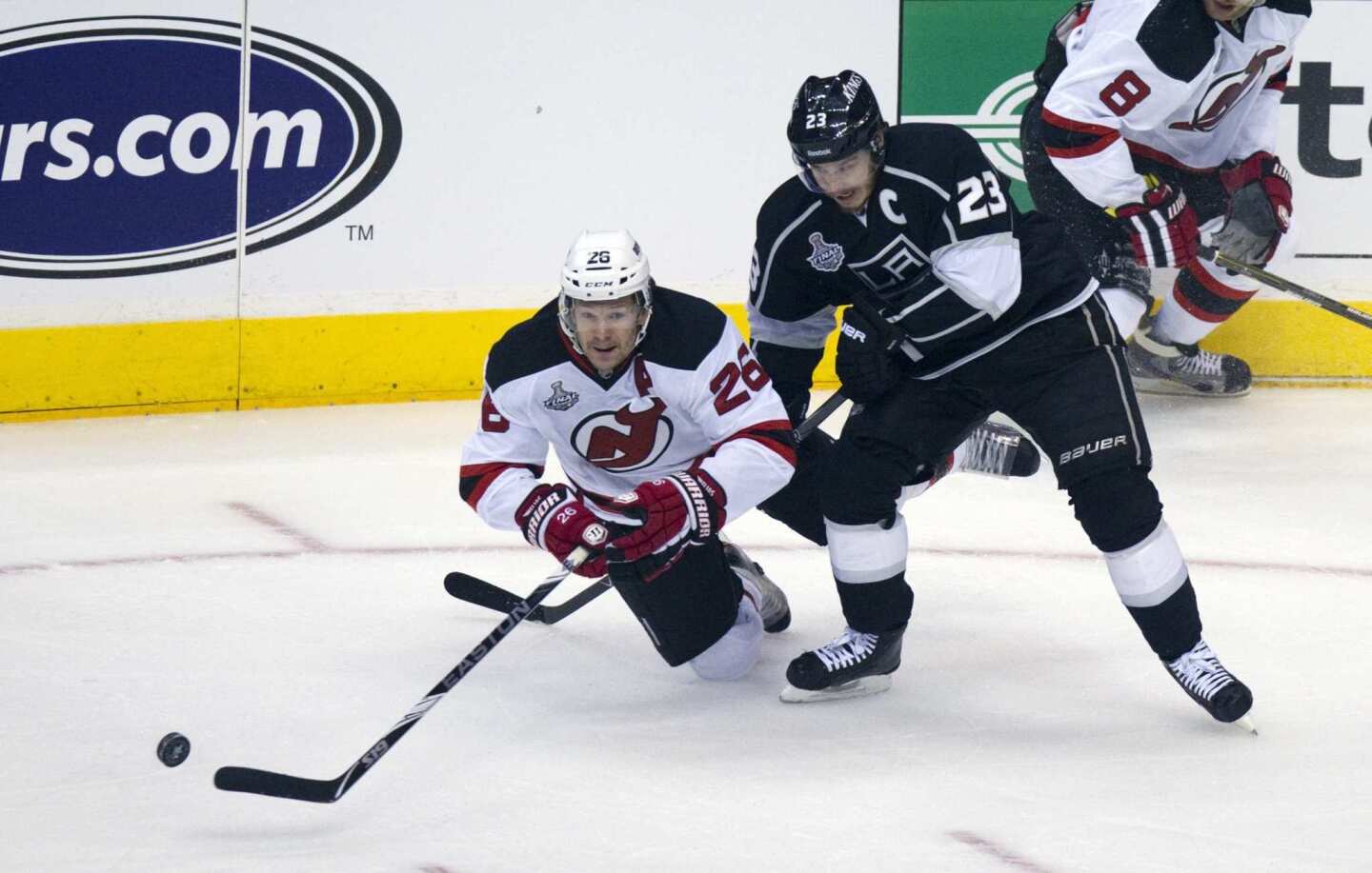 New Jersey forward Patrik Elias, left, and Kings captain Dustin Brown battle for the puck during the first period of Game 3 of the Stanley Cup Final.