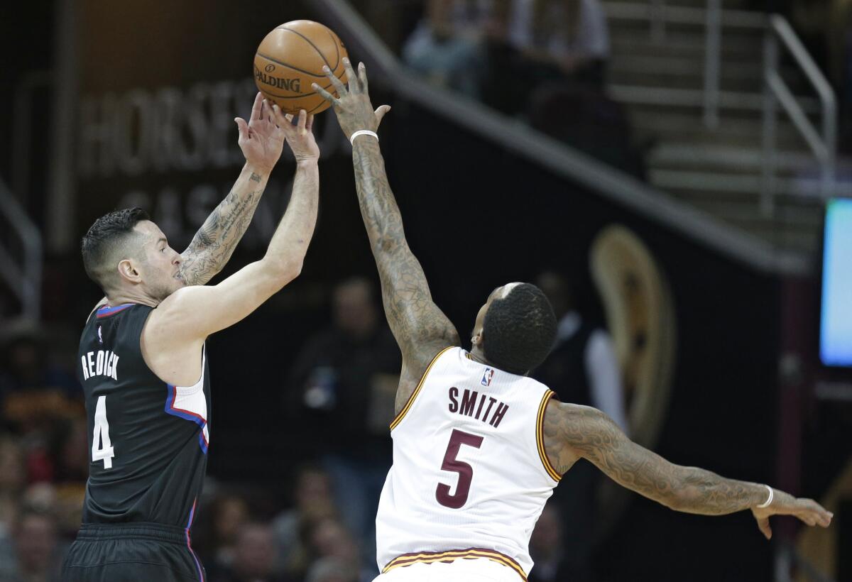 Clippers guard J.J. Redick shoots over Cavaliers guard J.R. Smith during the first half of a game on Jan. 21.