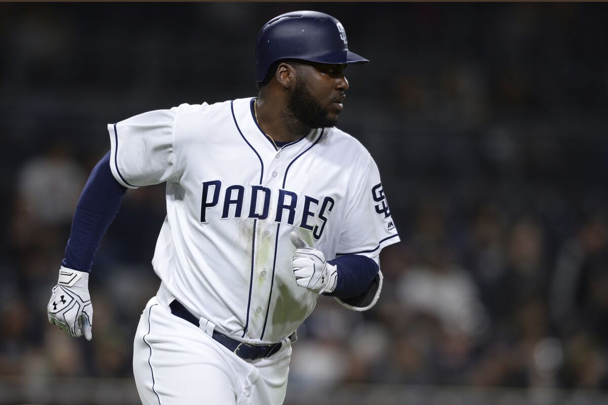 San Diego Padres' Franmil Reyes watches his home run during the ninth inning of a baseball game against the Atlanta Braves Tuesday, June 5, 2018, in San Diego. (AP Photo/Orlando Ramirez)