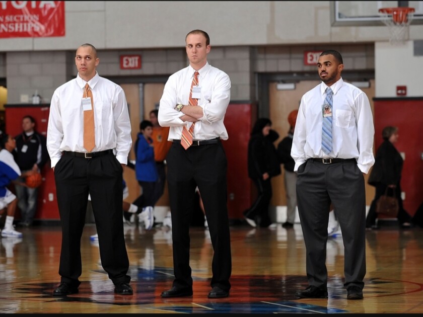 Todd Wolfson, center, and Nick Halic, right, used to coach together at Chaminade in 2009. Now they'll be facing off Thursday when St. Francis hosts Birmingham. At left is Mike Dulaney.
