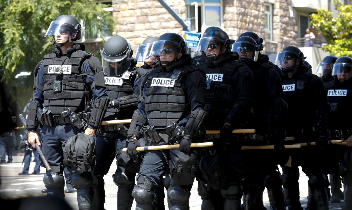 San Diego police in riot gear ready to prevent protesters from advancing to department headquarters in June 2020.