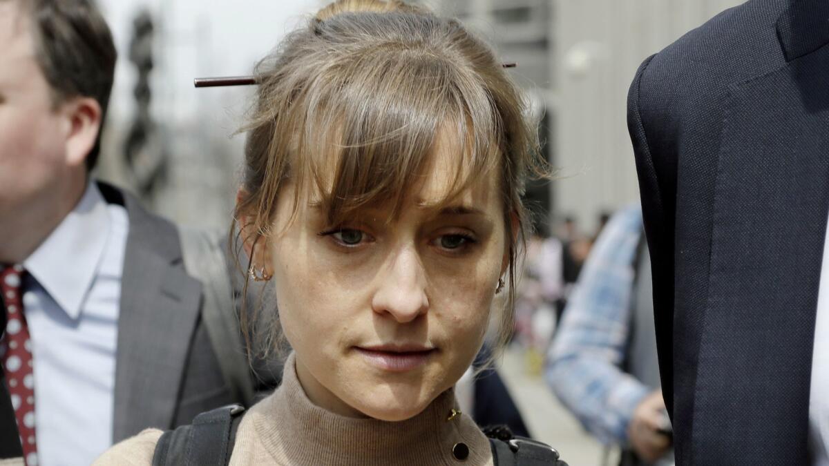 Actress Allison Mack leaves federal court in Brooklyn, N.Y., on April 8, 2019.