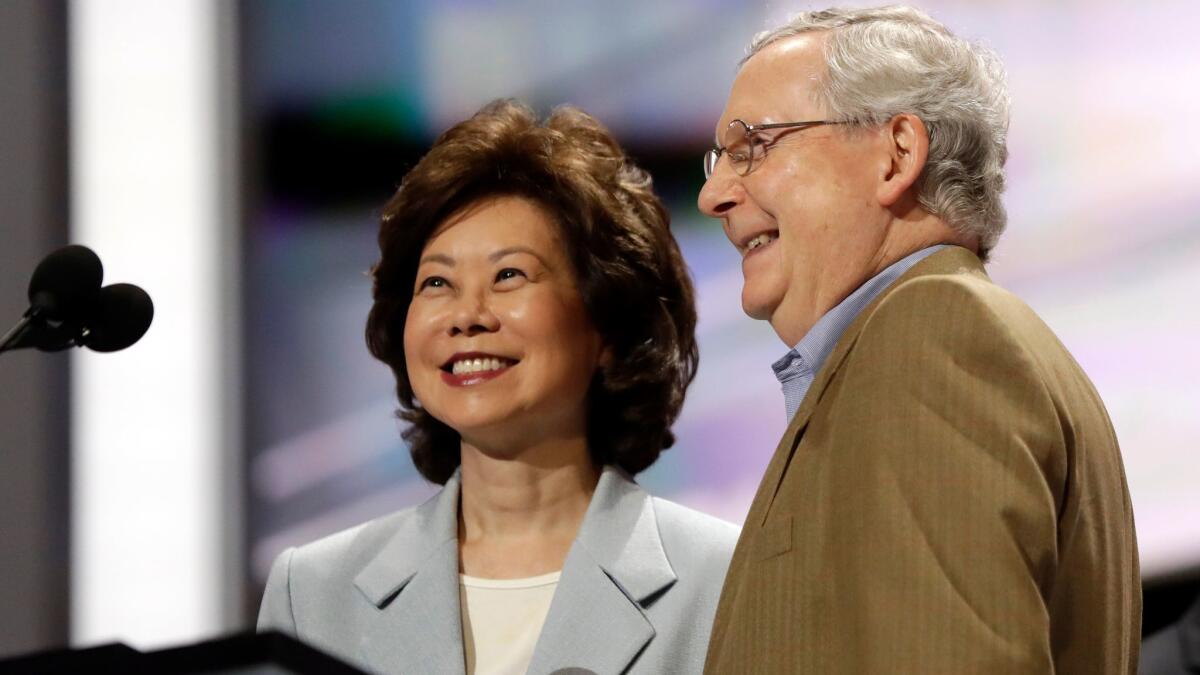 Former Labor Secretary Elaine Chao and her husband Mitch McConnell check out the stage during preparation for the Republican National Convention in Cleveland on July 17. President-elect Donald Trump has picked Elaine Chao to become his transportation secretary.