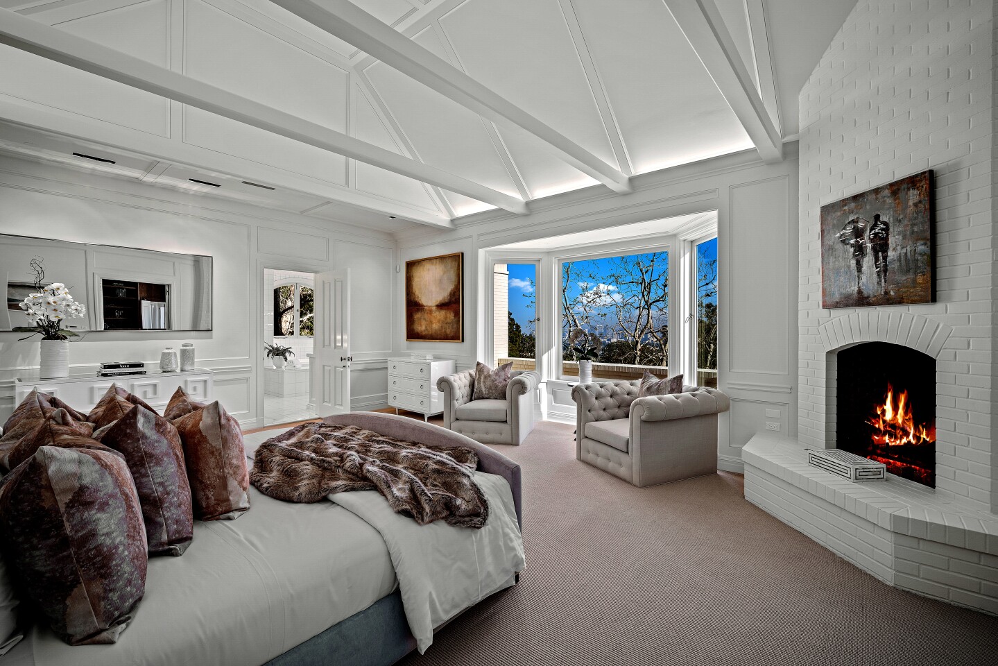 Sited below the Getty in Brentwood, the brick-clad residence was designed to evoke Denmark's traditional farmhouse architecture. Listed for $11.995 million, the Peter Chaote-designed house is reached by a winding drive that passes through a tunnel to reach the front motor court. The roughly two-third-acre property includes a greenhouse and a swimming pool. Expansive terraces center on views of the cityscape. The 7,958-square-foot house has a dual-island kitchen, a gym, four brick fireplaces, five bedrooms and 4.5 bathrooms.