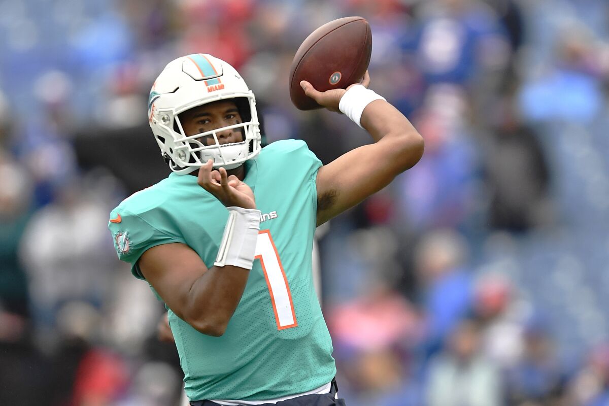 Miami Dolphins quarterback Tua Tagovailoa (1) warms up prior to an NFL football game against the Buffalo Bills, Sunday, Oct. 31, 2021, in Orchard Park, N.Y. (AP Photo/Adrian Kraus)
