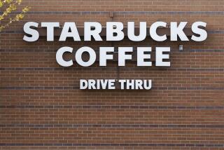 A Starbucks coffee shop logo is seen in the drive thru lane, Tuesday, April 27, 2021, in Des Moines, Iowa. (AP Photo/Charlie Neibergall)