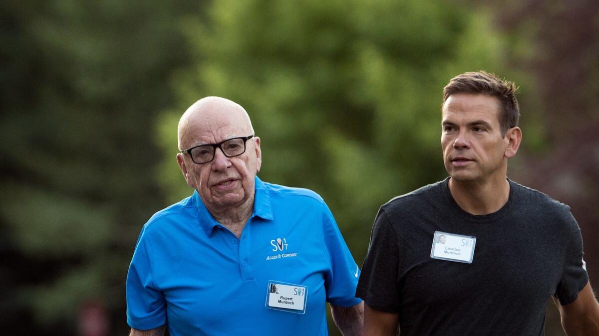 Rupert Murdoch, executive chairman of 21st Century Fox, and his son Lachlan Murdoch, who will become chairman and CEO of Fox following the sale of key assets to Disney.