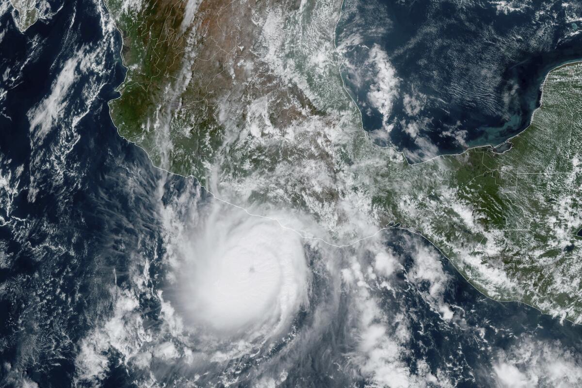 A satellite image shows Hurricane Otis approaching Mexico's Pacific coast.