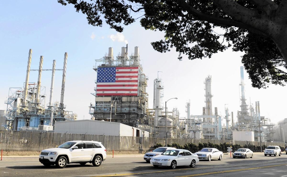 In May alone, the state’s fuel-making companies took in a record high of $1.17 a gallon at the refinery level, a report said. Above, the Tesoro petroleum refinery in Carson.
