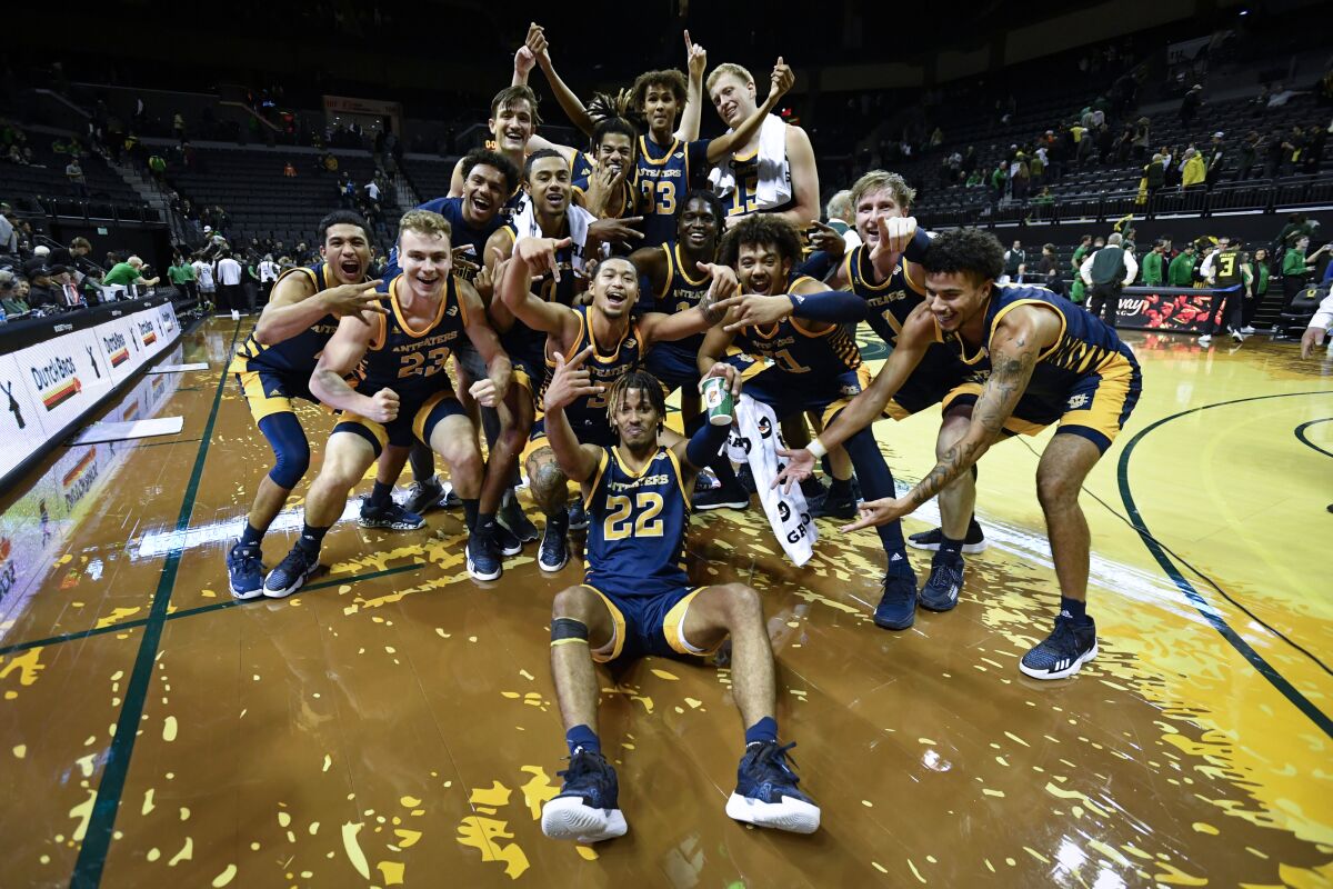 UC Irvine players celebrate after winning 69-56 at then-No. 21 Oregon on Nov. 11.