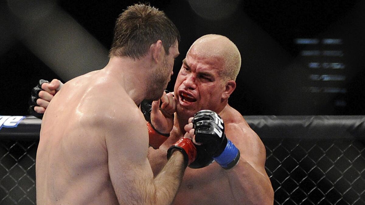 Tito Ortiz, right, and Forrest Griffin fight for the UFC light heavyweight title at UFC 148 in July 2012.