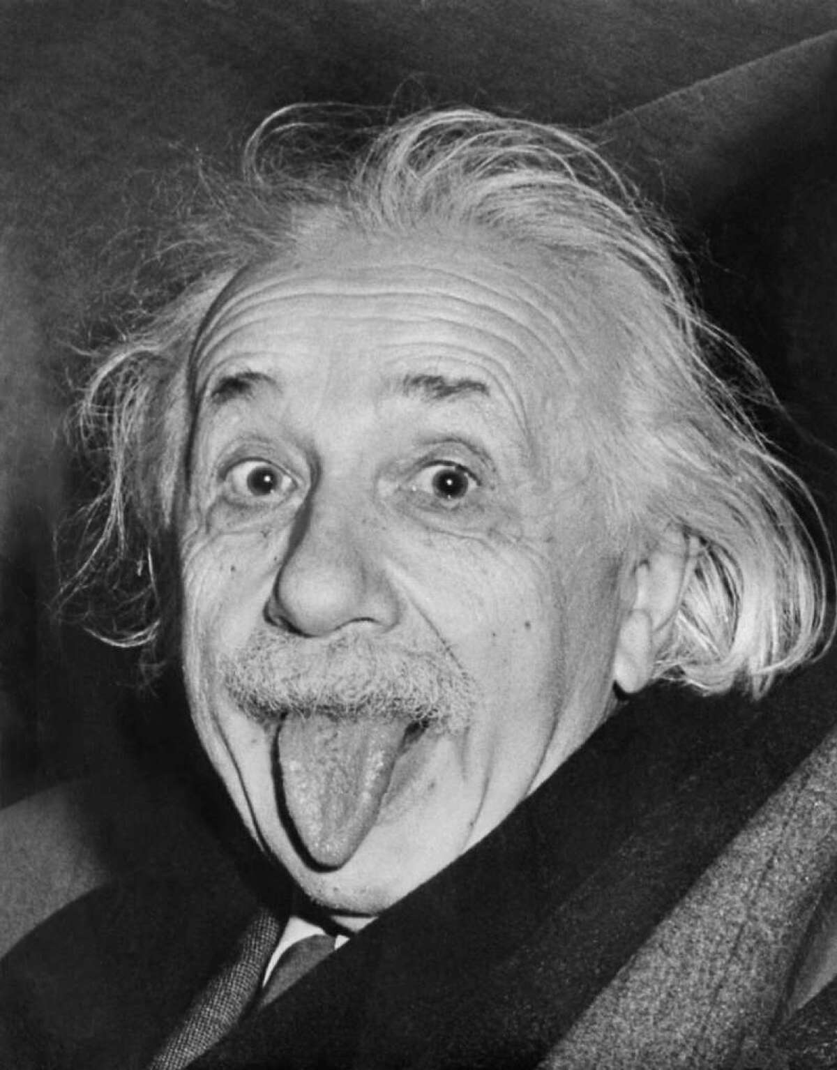Albert Einstein sticks out his tongue at reporters on his 72nd birthday. Would a tricky tongue twister have stumped even this genius?