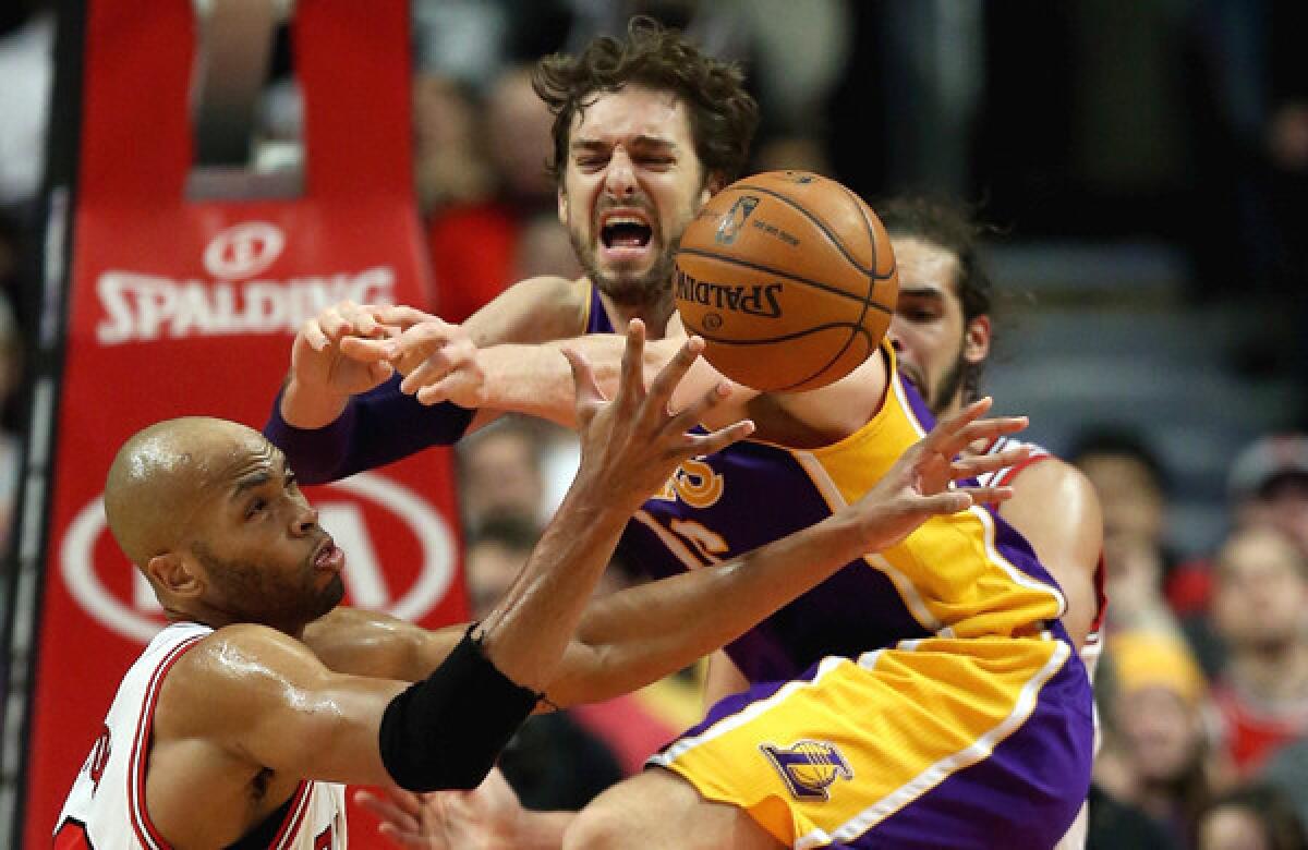 Chicago's Taj Gibson, left, grabs a loose ball in front of Lakers center Pau Gasol during a game on Jan. 20. Gasol's tenure with the Lakers could be coming to an end soon.