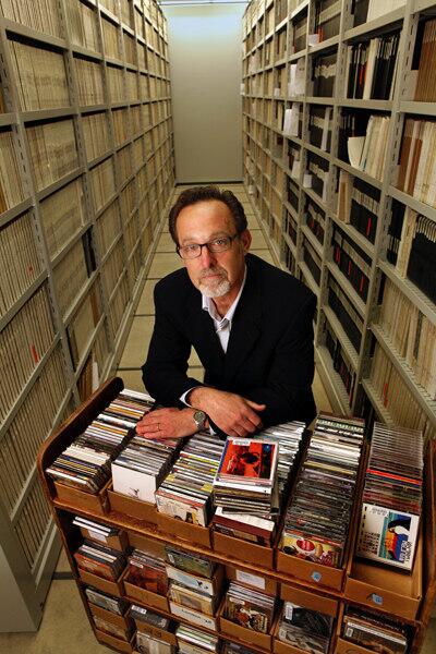 Gene DeAnna displays some of the Library of Congress' musical holdings. Story: Library of Congress builds the record collection of the century