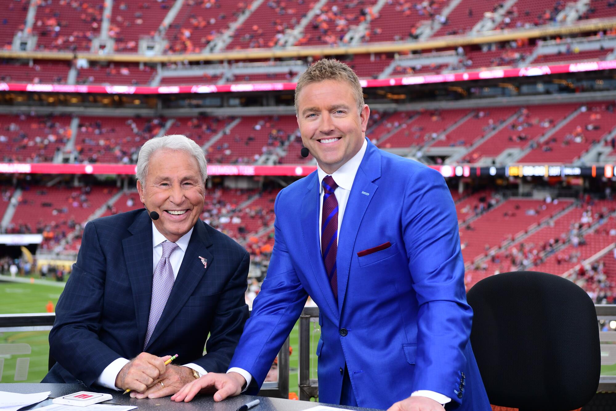 Lee Corso and Kirk Herbstreit sit on an ESPN set on Jan. 7, 2019, in Santa Clara.