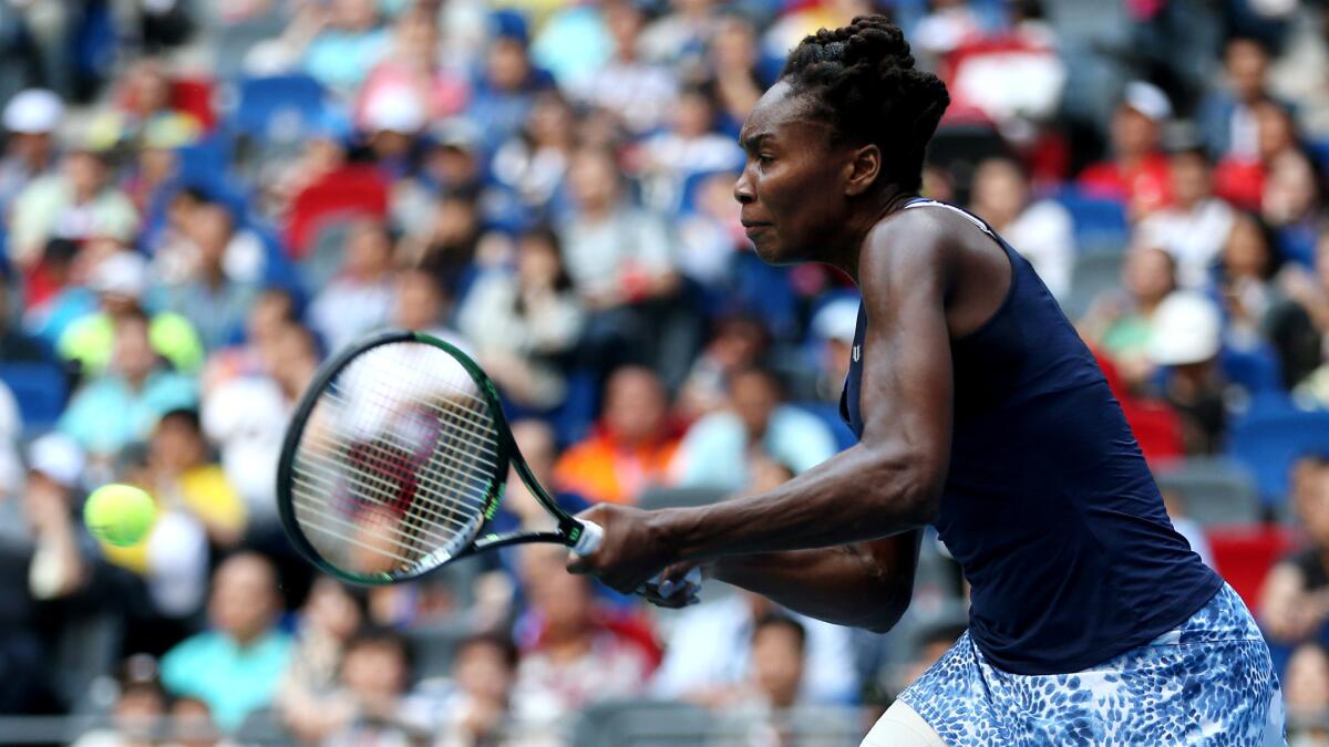 Venus Williams returns a shot during the final match of the Wuhan Open against Garbine Muguruza of Saturday.