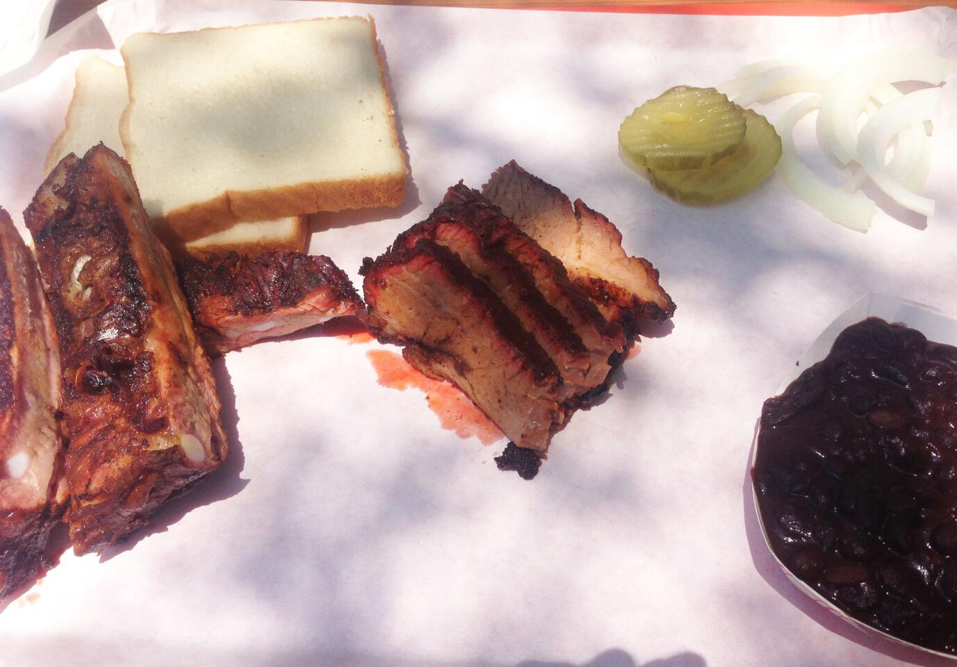 Barbecued meat and slices of white bread from Horse Thief at Grand Central Market.