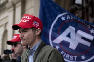 FILE - Nick Fuentes, far-right activist, holds a rally at the Lansing Capitol, in Lansing, Mich., Nov. 11, 2020. Former President Donald Trump had dinner Tuesday, Nov. 22, 2022, at his Mar-a-Lago club with the rapper formerly known as Kanye West, who is now known as Ye, as well as Nick Fuentes, who has used his online platform to spew antisemitic and white supremacist rhetoric. (Nicole Hester/Ann Arbor News via AP, File)