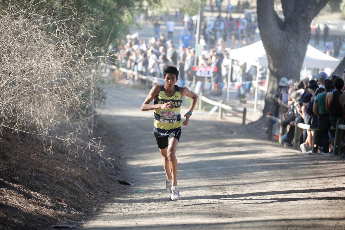 Millikan High's Jason Parra starts up the switchbacks at the one-mile mark in the Mt. SAC Cross-Country Invitational.