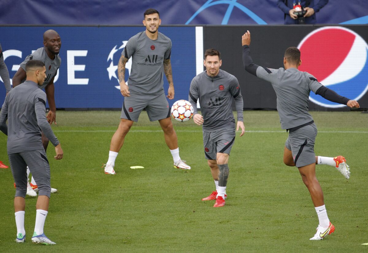 PSG's Lionel Messi, center right, during training at the Jan Breydel Stadium in Bruges, Belgium, Tuesday, Sept. 14, 2021. PSG will play its Champions League Group A soccer match against Club Brugge on Wednesday. (AP Photo/Olivier Matthys)