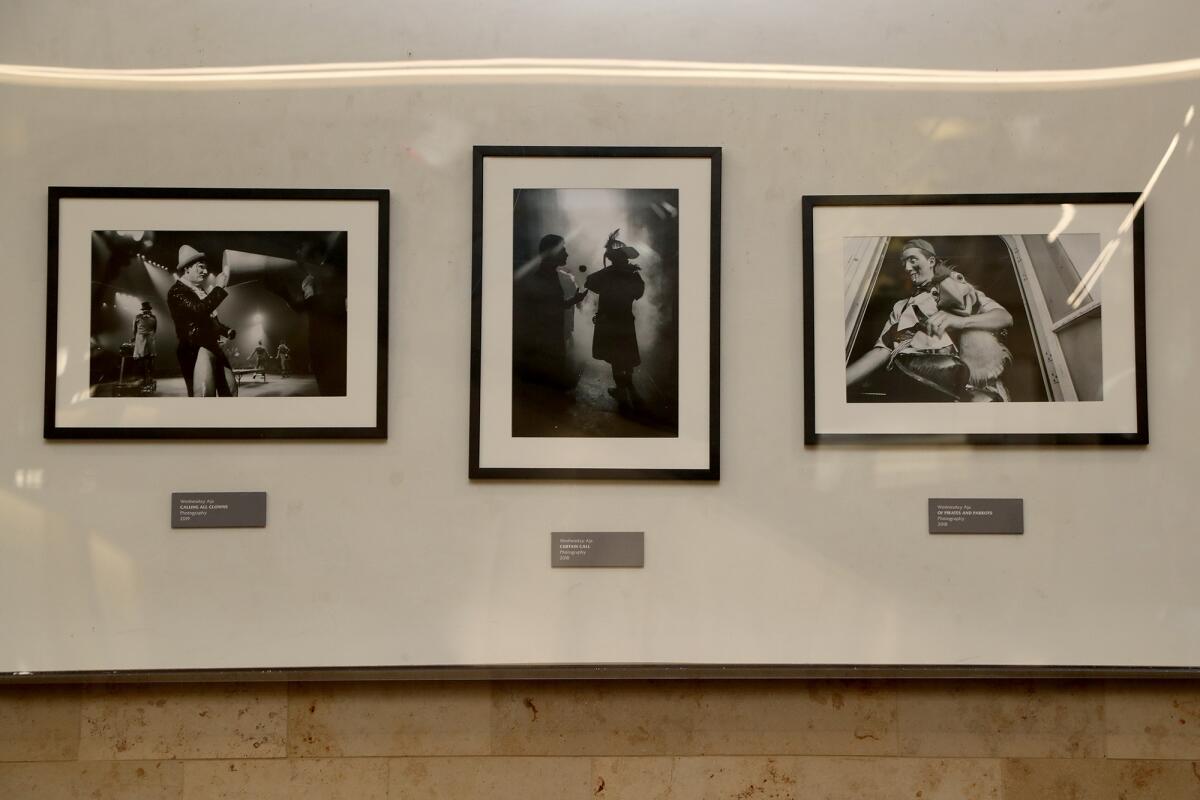 Three pictures of circus performers by photographer Wednesday Aja located at John Wayne Airport. 