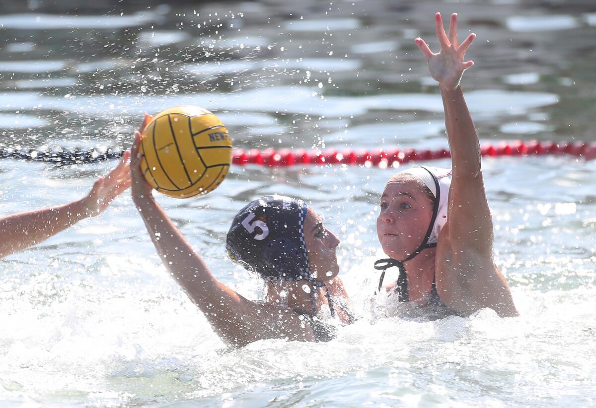 Newport Harbor's Audrey Metcalf (5) fires a shot to the goal against Corona del Mar on Thursday.