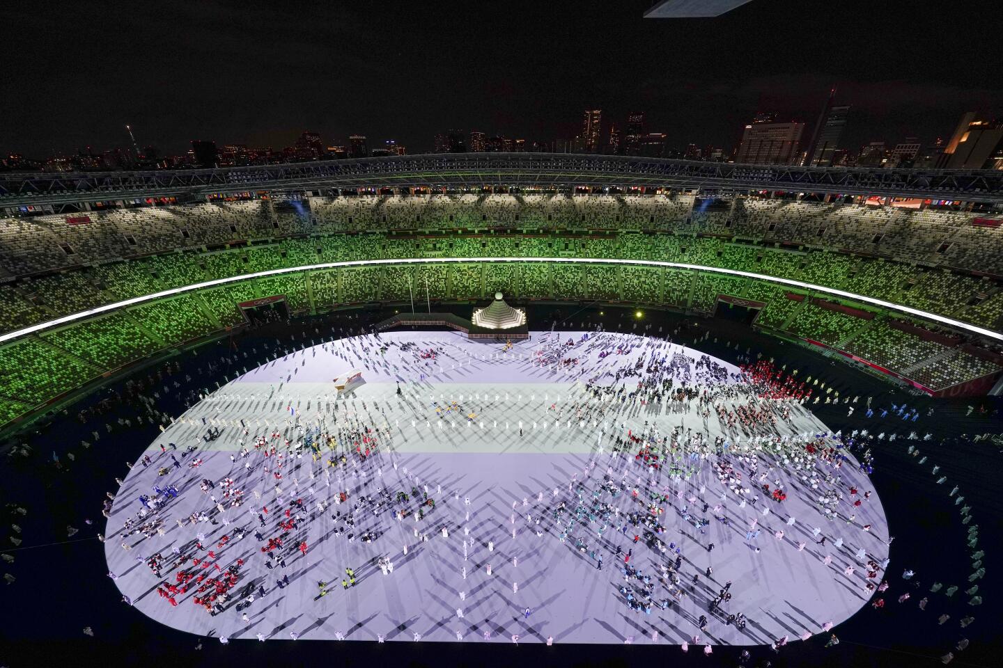 Athletes are introduced during the opening ceremony at the Olympic Stadium at the 2020 Summer Olympics, Friday, July 23, 2021, in Tokyo. (AP Photo/Morry Gash)