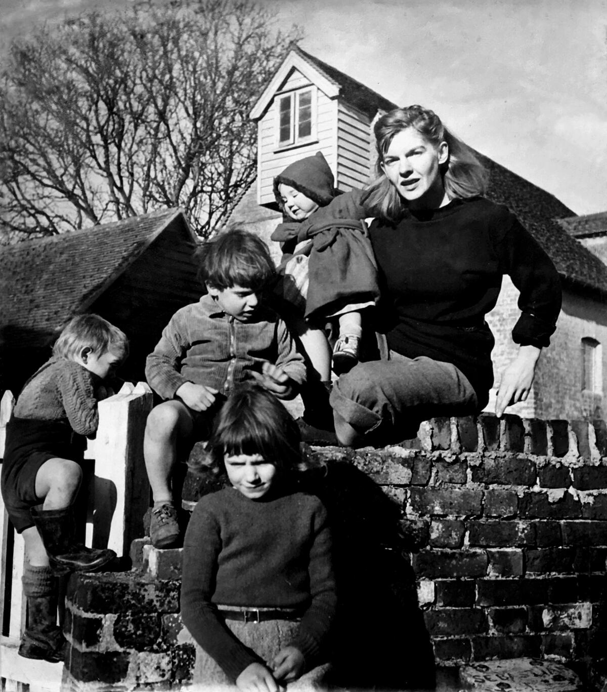 Elizabeth Smart with Sebastian, Christopher, Georgina, and Rose Barker at Tilty Mill House, their home in Essex, 1948.