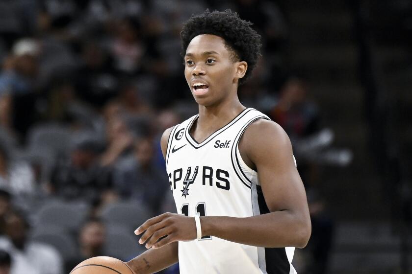 Spurs guard Josh Primo brings the ball up court during a 2022 preseason game against the Thunder