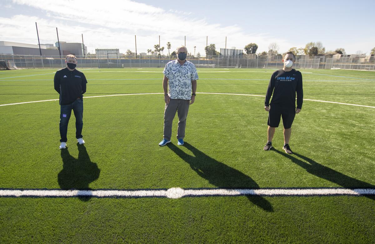 Damien O'Brien, left, GW Mix and Bryan Middleton on the back turf at Corona del Mar High.