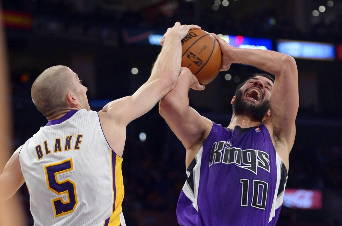 Lakers point guard Steve Blake blocks a shot by Kings guard Greivis Vasquez.