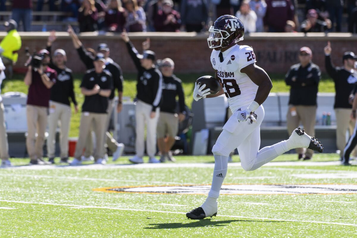 Texas A&M running back Isaiah Spiller scores a touchdown during the first quarter of an NCAA college football game against Missouri Saturday, Oct. 16, 2021, in Columbia, Mo. (AP Photo/L.G. Patterson)