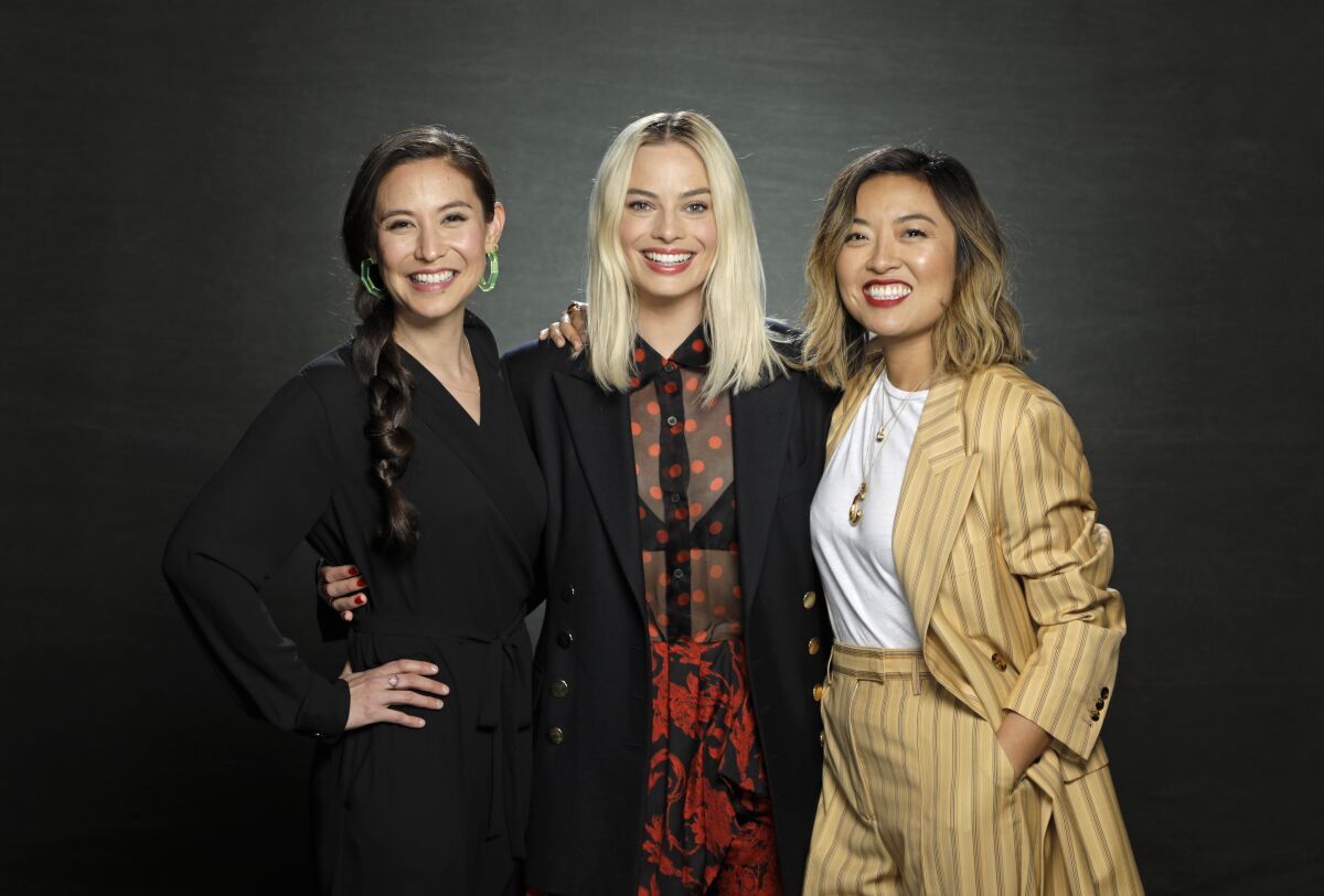 Margot Robbie, center, with "Birds of Prey" screenwriter Christina Hodson, left, and director Cathy Yan. Of the trio's instant creative synergy, Robbie says: "We were all on the same page from the get-go."