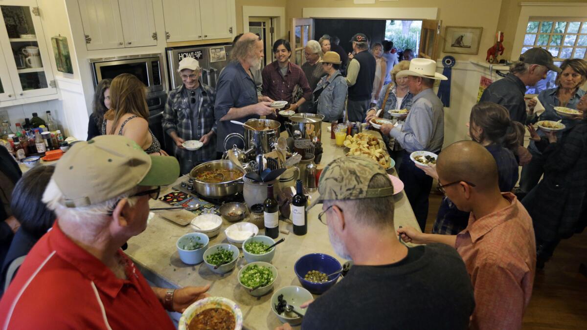 Concerts at the Deep End ranch are always followed by a communal chili dinner. Guests gather for a bowl in David Bunn's kitchen.
