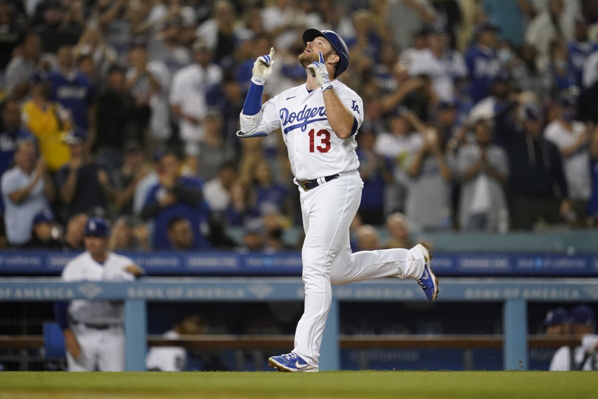 Max Muncy celebrates after hitting a two-run home run in the third inning.