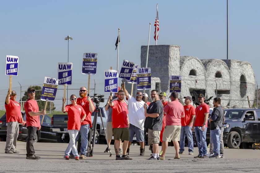 United Auto Workers union members strike outside the Chrysler Toledo Assembly Plant in Toledo, Ohio on Tuesday, Oct. 3, 2023. (Phillip L. Kaplan/The Blade via AP)