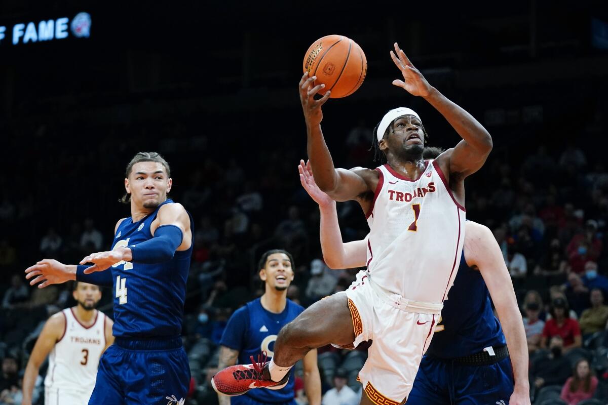 USC forward Chevez Goodwin drives to the basket after getting past Georgia Tech guard Jordan Usher 