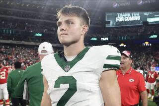 New York Jets quarterback Zach Wilson (2) walks off the field after playing against the Kansas City Chiefs.
