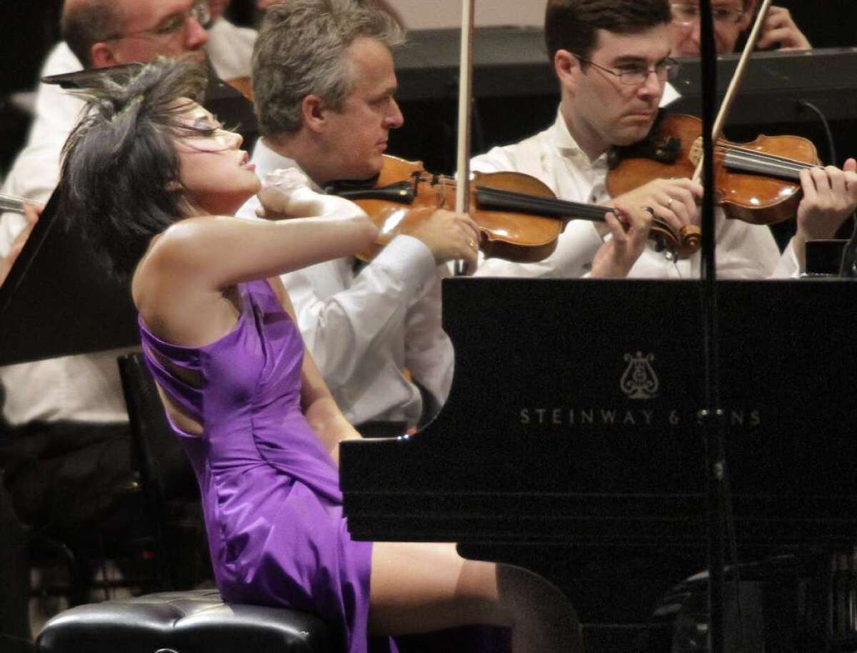 Yuja Wang is shown at the Hollywood Bowl in 2012. The star pianist will perform George Gershwin's Piano Concerto in F with the London Symphony Orchestra, conducted by Michael Tilson Thomas, at Segerstrom Concert Hall in Costa Mesa as part of the Philharmonic Society of Orange County's just-announced 2014-15 season.