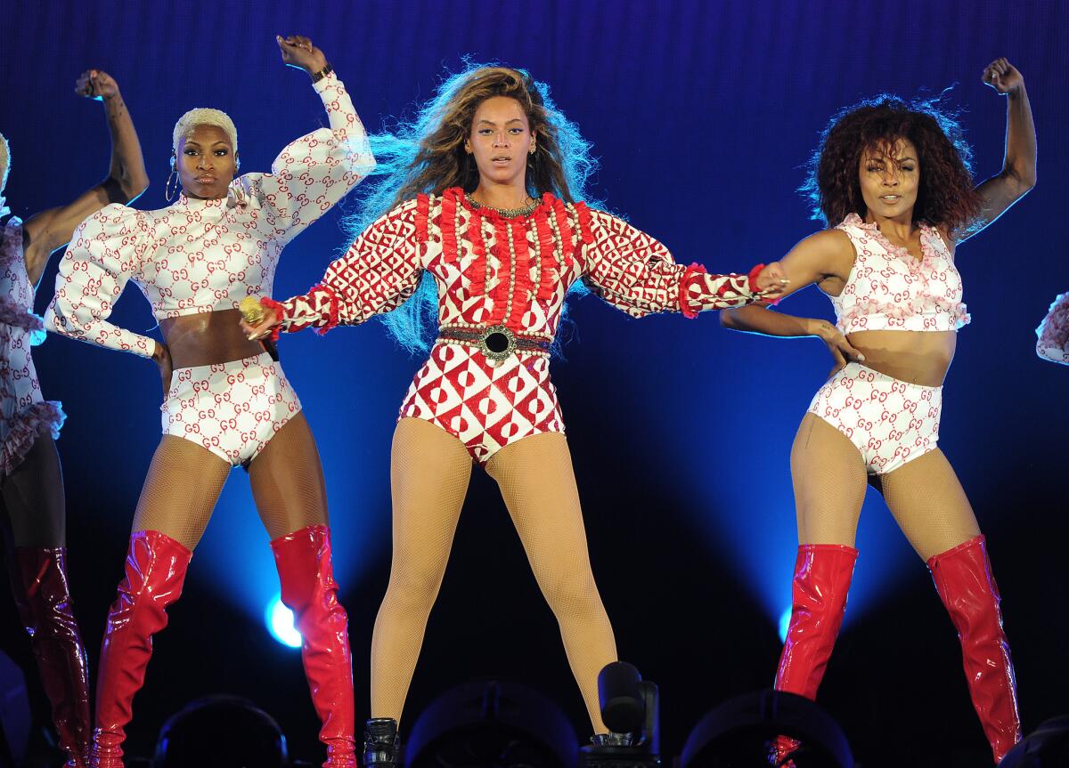 Beyoncé performs in a red and ivory geometric sequined bodysuit by Gucci, one of several looks created for her by the Italian luxury label, on the April 27, 2016, opening night of her Formation World Tour in Miami.