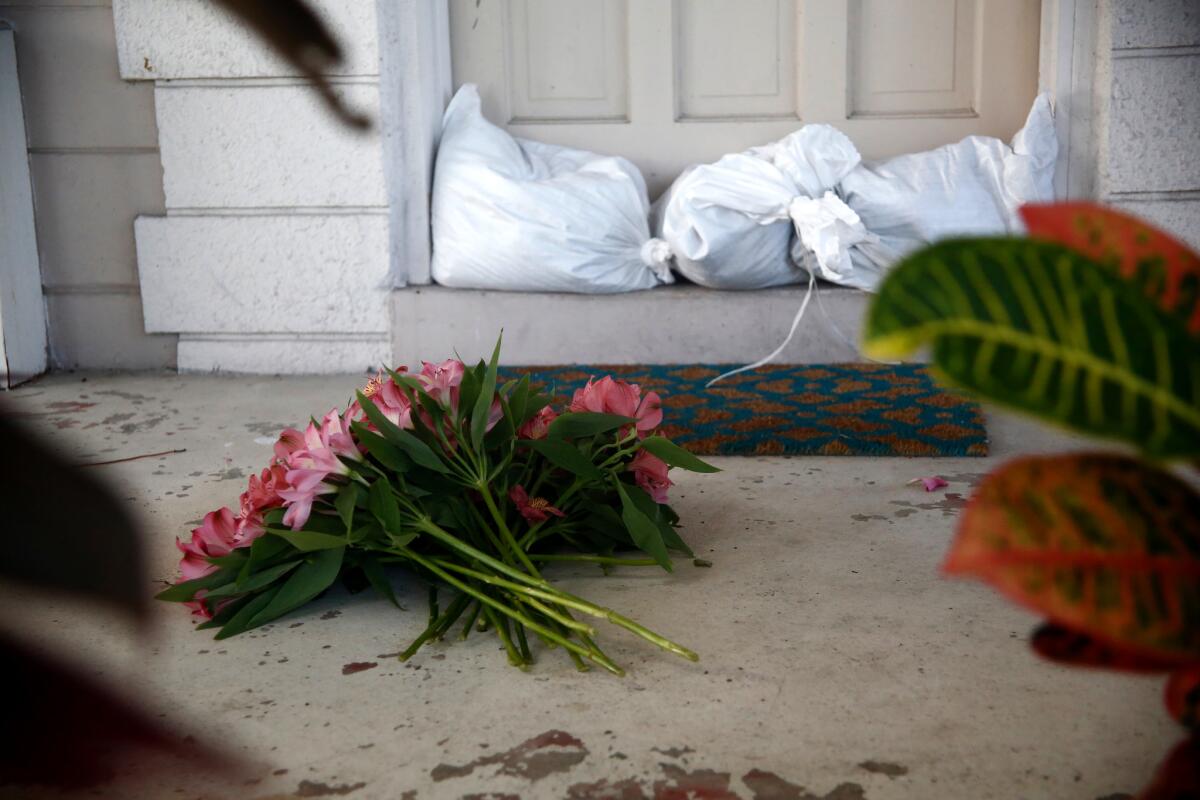 A resident left flowers after evacuating her home in the approach of Hurricane Irma in St. Petersburg, Fla.