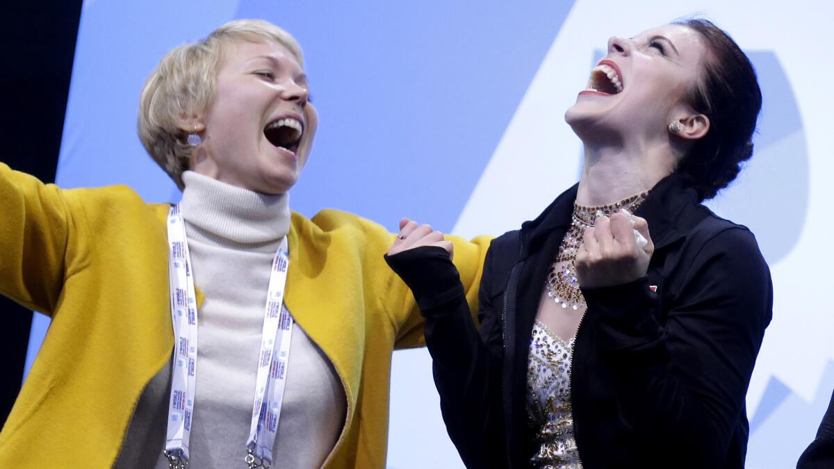 Ashley Wagner, right, and her choreographer, Nadia Kanaeva, react after seeing her scores for the free skate Saturday.