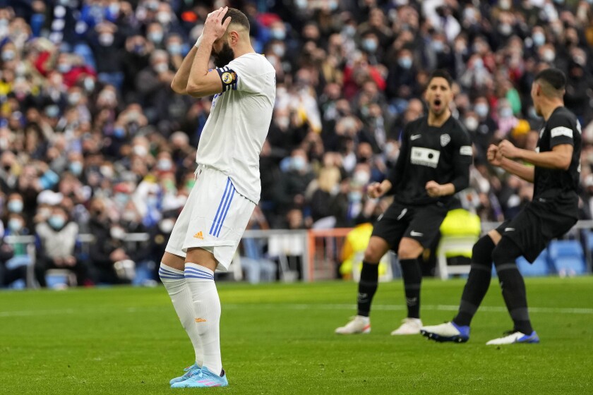 Real Madrid's Karim Benzema reacts after he failed top score during a Spanish La Liga soccer match between Real Madrid and Elche at the Bernabeu stadium in Madrid, Spain, Sunday, Jan. 23, 2022. (AP Photo/Manu Fernandez)