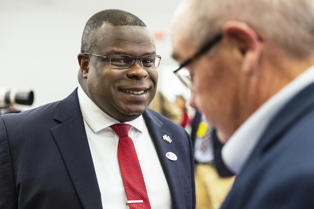 John Gibbs talks to a supporter.